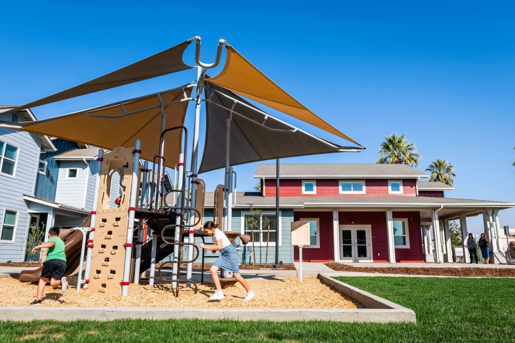 Photo of children playing at Palm Terrace playground in Lindsay