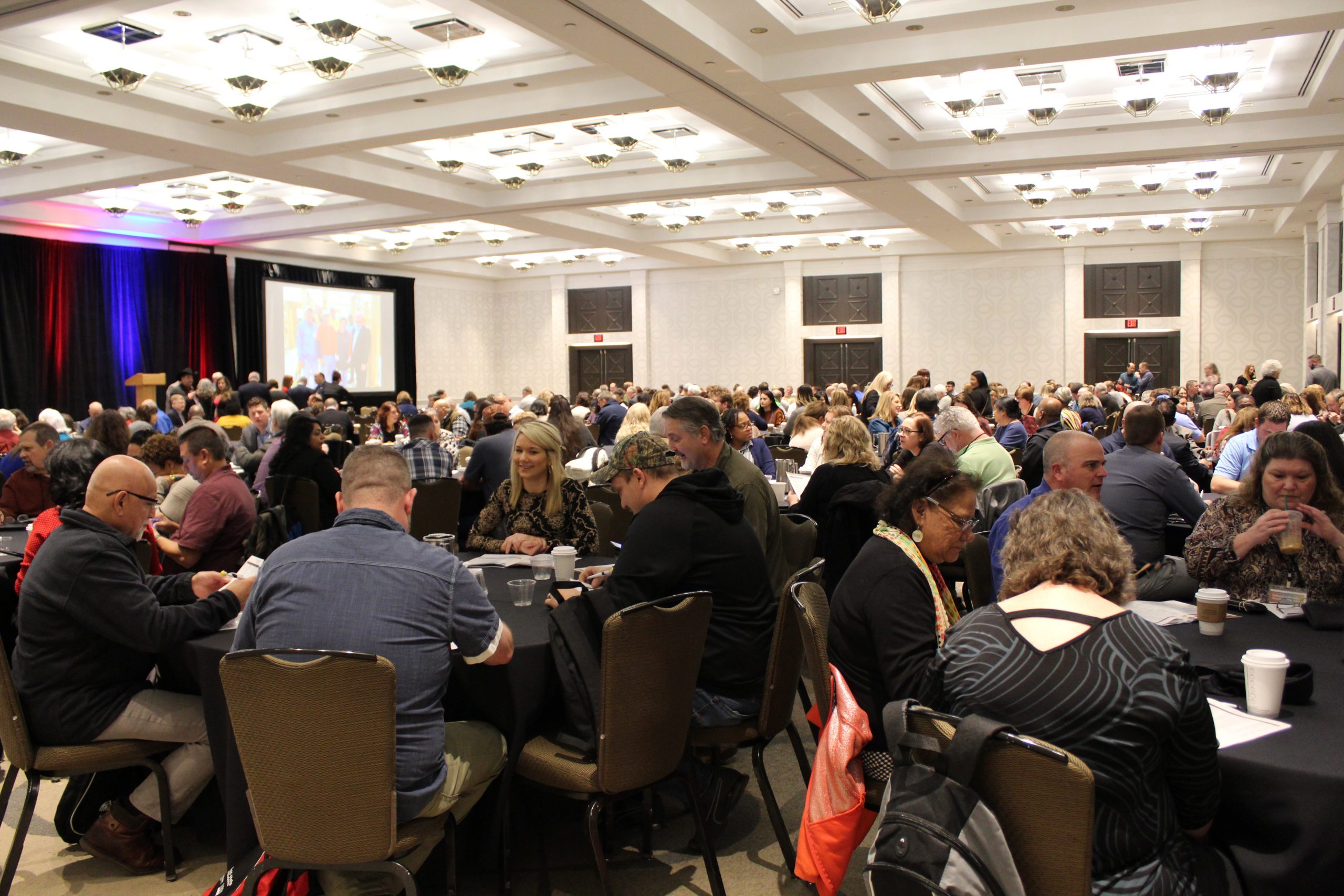 room full of conference attendees